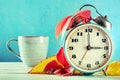 Daylight Savings Time concept, fall back in autumn. A retro alarm clock Royalty Free Stock Photo