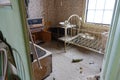 Daylight shines through the washroom window and on the dusty crib and bath.