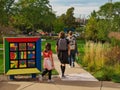 Daylight shot of three young kids walking at Joslyn Art Museum in Omaha, Nebraska, USA