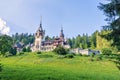 Daylight side far view to Peles castle front facade with hanging Royalty Free Stock Photo