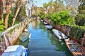 Daylight view to local canal with parked boats Royalty Free Stock Photo