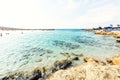 Daylight view to Nissi Beach with colorful bright blue water and