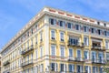 Daylight view to yellow building of a hotel in Nice Cote d`Azur Royalty Free Stock Photo