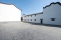 Whitewashed Courtyard with Dark Tiled Roofs and Curved Eaves Royalty Free Stock Photo