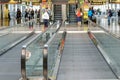 Daylighting roof structure with people walking and people movers Royalty Free Stock Photo