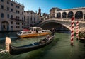 The days of gondoliers. Rialto Bridge. The beauty of old Venice. Italy