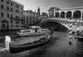 The days of gondoliers. Rialto Bridge. The beauty of old Venice. Italy. Black white