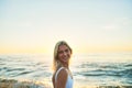 Days not at the beach are days wasted. Cropped portrait of an attractive young female smiling over her shoulder on the