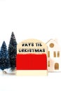 Days til Christmas vintage style wood calendar on white background.