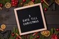 Three Days till Christmas countdown letter board on dark rustic wood Royalty Free Stock Photo