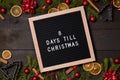 Eight Days till Christmas countdown letter board on dark rustic wood