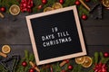 19 Days till Christmas countdown letter board on dark rustic wood Royalty Free Stock Photo