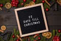 22 Days till Christmas countdown letter board on dark rustic wood Royalty Free Stock Photo