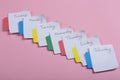 The days of the week - the paper stickers attached to the pink background Royalty Free Stock Photo