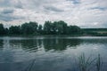 Daytime fishing in the summer on a pond.