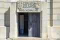 Daytime image of the door and pillar of the Alameda fountain monument in Lisbon.