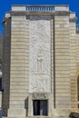 Daytime image of the door and pillar of the Alameda fountain monument in Lisbon.