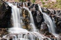 Daytime long exposure of Gooseberry Falls waterfalls at the state park in Minnesota in summer. Close up view Royalty Free Stock Photo