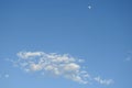 Clouds Drifting Below a Daytime Moon