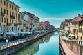 Daytime scenic view of Naviglio Grande, Naviglio Grand canal full with restaurants, bars and people in Milan