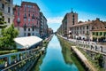 Daytime scenic view of Naviglio Grande, Naviglio Grand canal full with restaurants, bars and people in Milan