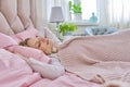 Daytime sleep, mature woman sleeping on bed