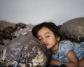 Daytime sleeping time of a toddler child. Little girl sleeping on the bed