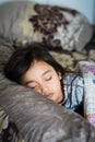 Daytime sleeping time of a toddler child. Little girl sleeping on the bed