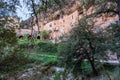 Daytime street-level view of El Puig de la Balma, an old farmhouse carved into the rock, located in Mura