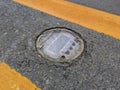 Daytime view of recessed solar road stud markers embedded in the center lane of an asphalted highway. Also known as a road Royalty Free Stock Photo