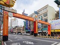 Daytime view of an temple arch with cityscape in West Central District area