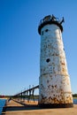 Daytime at Weathered Empire Lighthouse, Michigan with Fishing Activities on Pier