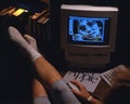 Daytona Beach, FL-circa January 1996: Doing homework on an early model Apple computer