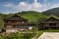View of the village of Dazhai, with wood houses and rice fields along the slopes of the surrounding mountains in China