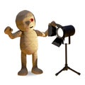 Dazzled Egyptian mummy monster stares into a studio light, 3d illustration Royalty Free Stock Photo