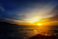 The dazzling bright sunset over a tropical ocean Royalty Free Stock Photo