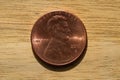 2011 US Penny Closeup Featuring Lincoln\'s Profile Against Wood Backdrop Royalty Free Stock Photo