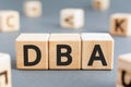 DBA - acronym from wooden blocks with letters