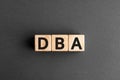 DBA - acronym from wooden blocks with letters