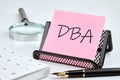 DBA word on the sticker on the stand on a white background Royalty Free Stock Photo