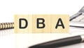 DBA a word written on wooden cubes on a white background Royalty Free Stock Photo