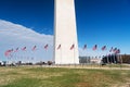 DC, Washington. American flags at George Washington`s monument on a sunny day with a blue cloudless sky background Royalty Free Stock Photo