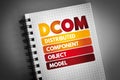 DCOM - Distributed Component Object Model acronym on notepad, technology concept background Royalty Free Stock Photo
