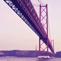 25 de Abril Bridge in Lisbon, Portugal, with a retro filter effect Royalty Free Stock Photo