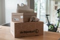 De Bijenkorf online package delivery, unboxing package, online shopping, fashion shoes, white sneakers, box on the table