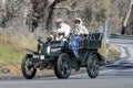 1904 De Dion Bouton 8 hp V Tonnaeu driving on country road Royalty Free Stock Photo