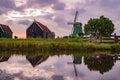 De Gekroonde Poelenburg windmill and Dutch houses with reflection Royalty Free Stock Photo