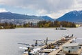 De Havilland Beaver float planes docked at Vancouver`s Harbour Airport in overcast day