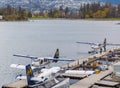 De Havilland Beaver float planes docked at Vancouver`s Harbour Airport in overcast day