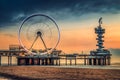 De Pier, Pier in Scheveningen with open-air decks against the cloudy sunset sky at the beach Royalty Free Stock Photo